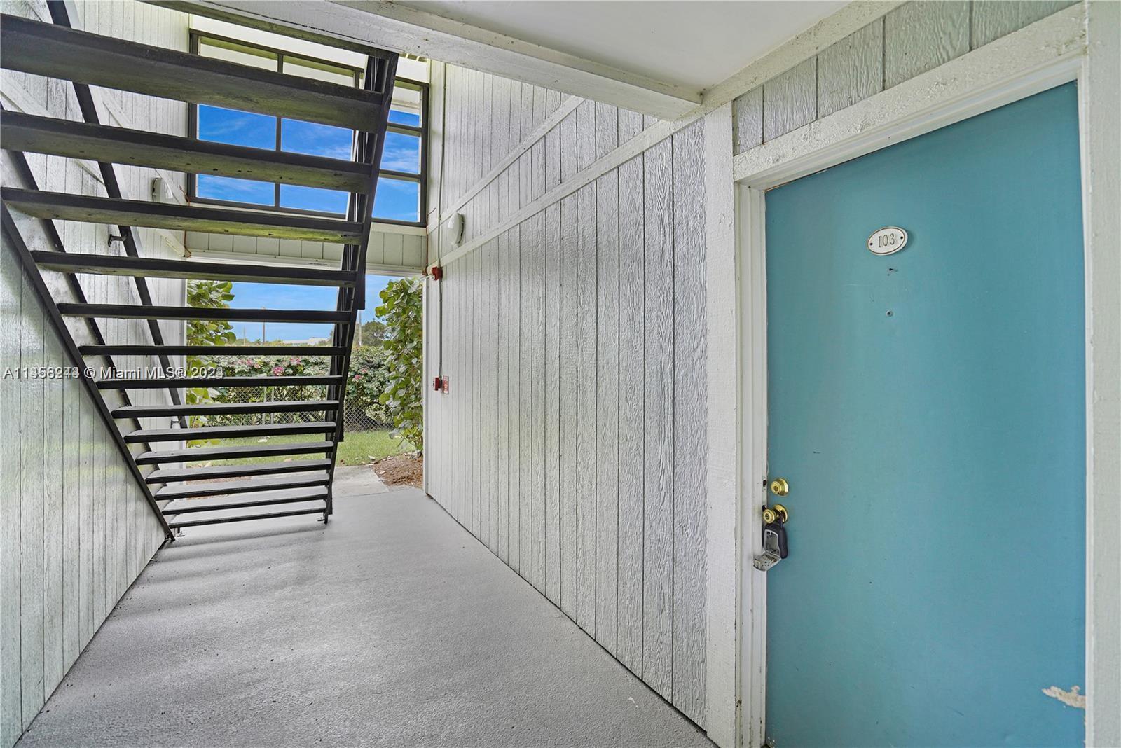 9727 Hammocks Boulevard, Unit 103D Miami, FL 33196 - Photo 8 of 11 a view of a hallway