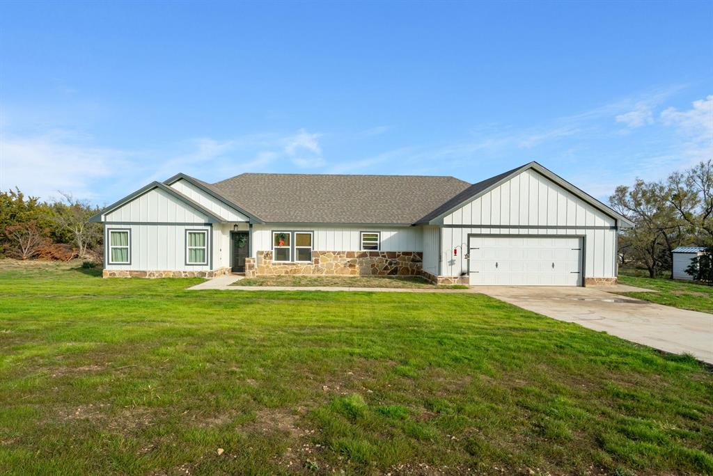 95 Ruidoso Way Mineral Wells, TX 76067 - Photo 1 of 1 View of front of home featuring a front yard and a garage