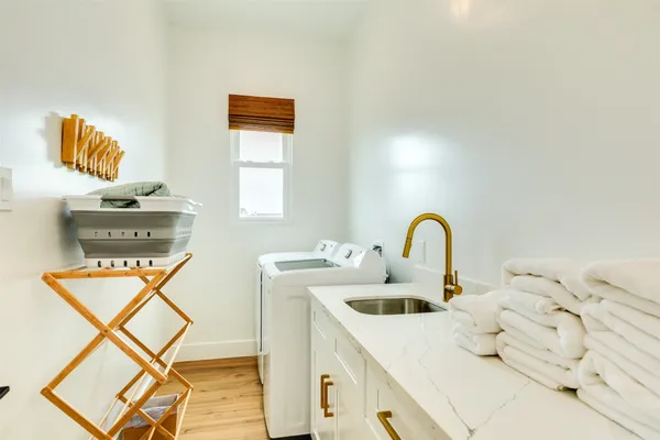 a kitchen with a stove a sink and a cabinets