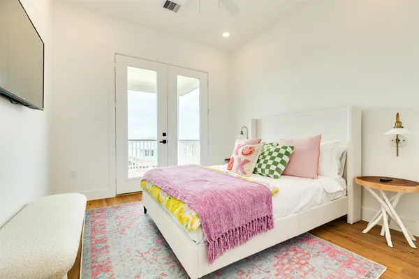 a bedroom with a bed and a couch