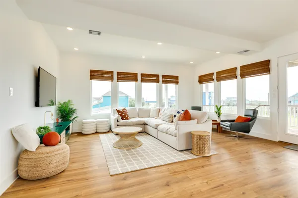 a living room with furniture and a large window