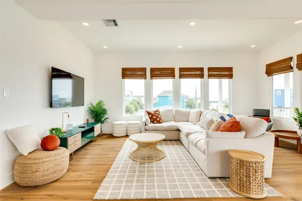 a living room with furniture and a large window