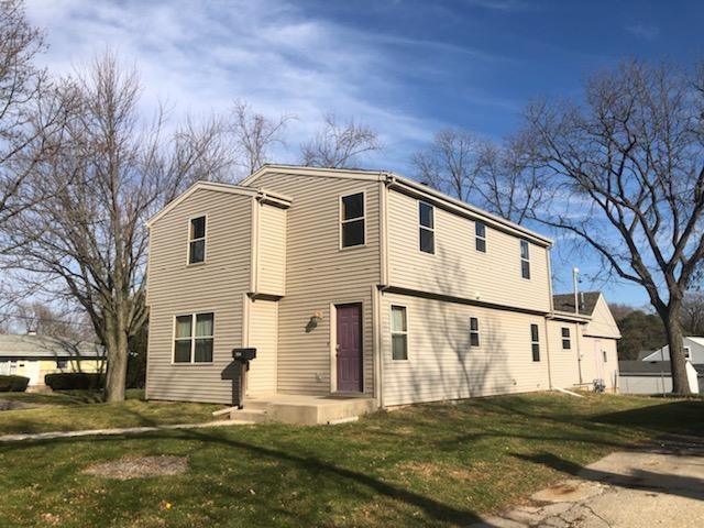 1904 Ridgeland Road Rockford, IL 61108 - Photo 1 of 20 a front view of a house with a yard