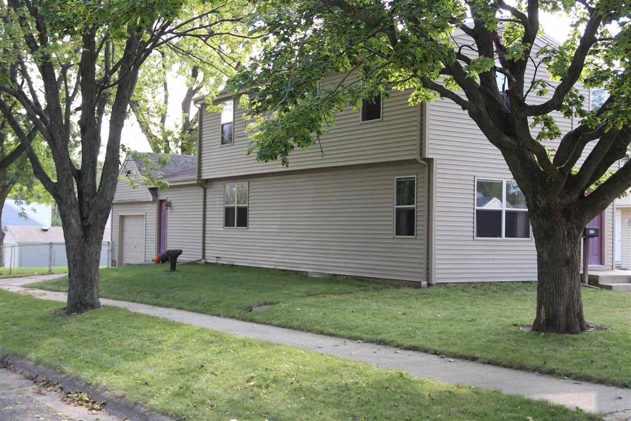 1904 Ridgeland Road Rockford, IL 61108 - Photo 18 of 20 a front view of a house with a garden