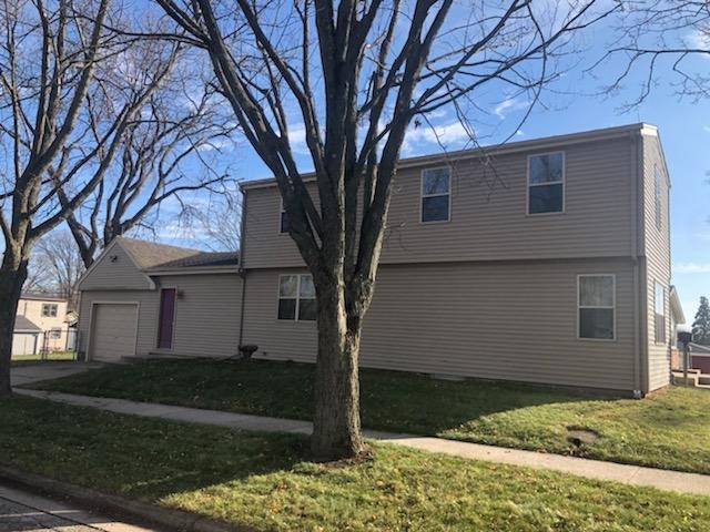 1904 Ridgeland Road Rockford, IL 61108 - Photo 2 of 20 a house that has a tree in front of the house