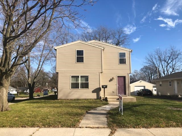 1904 Ridgeland Road Rockford, IL 61108 - Photo 3 of 20 a front view of a house with a yard