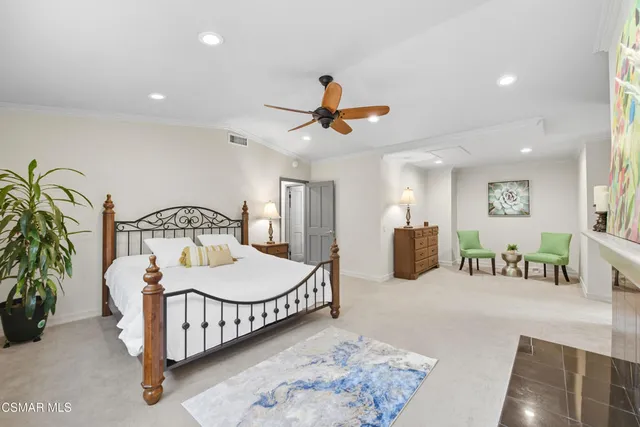 a bedroom with furniture and a chandelier