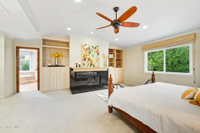 a bed room with a bed and a television