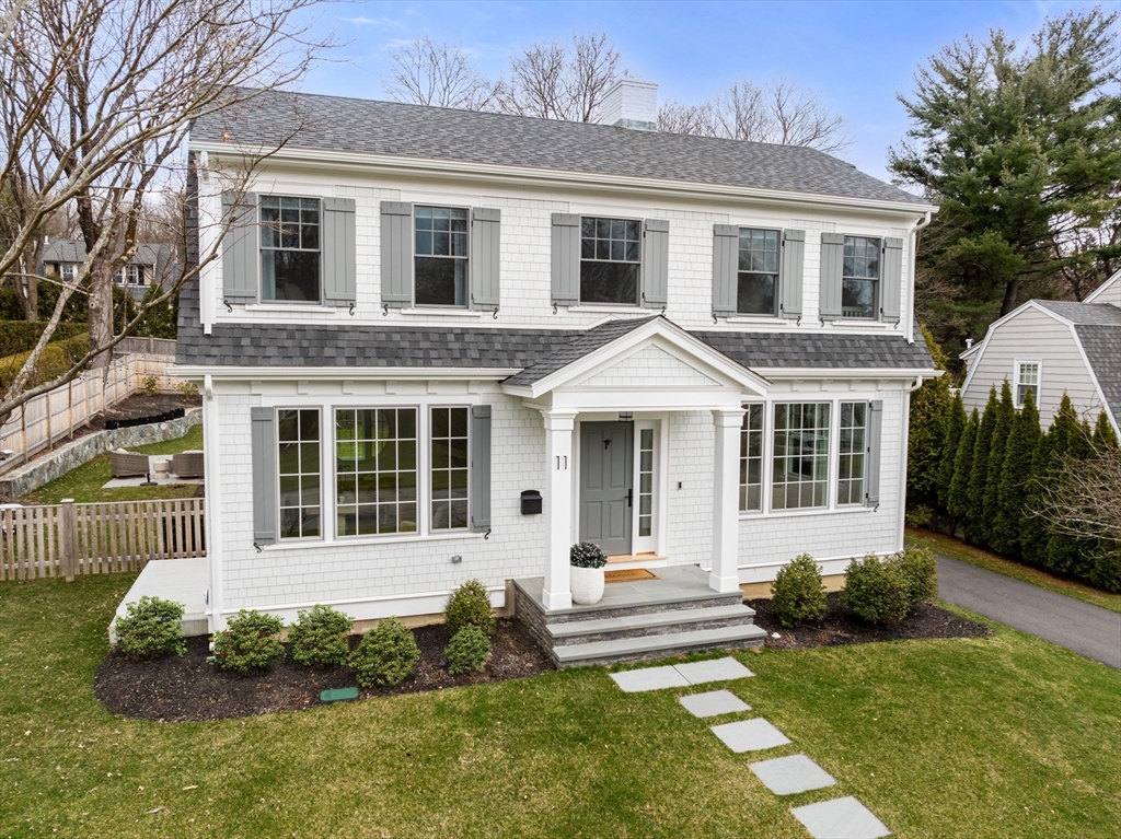 11 Shaw Road Wellesley, MA 02481 - Photo 1 of 22 a front view of a house with a yard and porch