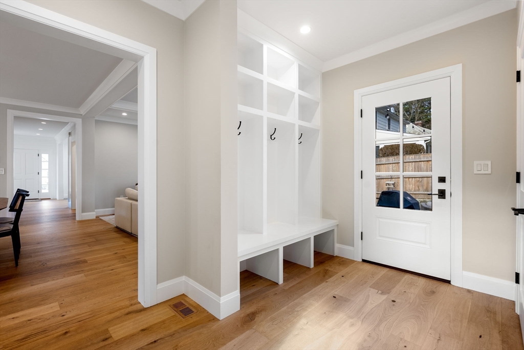 11 Shaw Road Wellesley, MA 02481 - Photo 20 of 22 a view of an empty room with wooden floor and a window