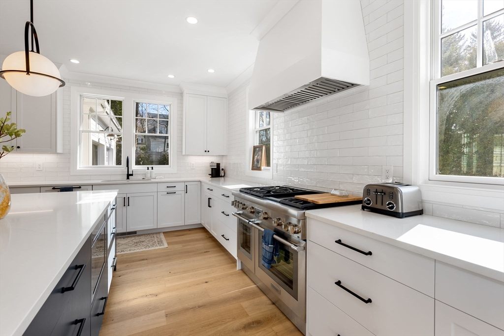 11 Shaw Road Wellesley, MA 02481 - Photo 3 of 22 a kitchen with a stove and a sink