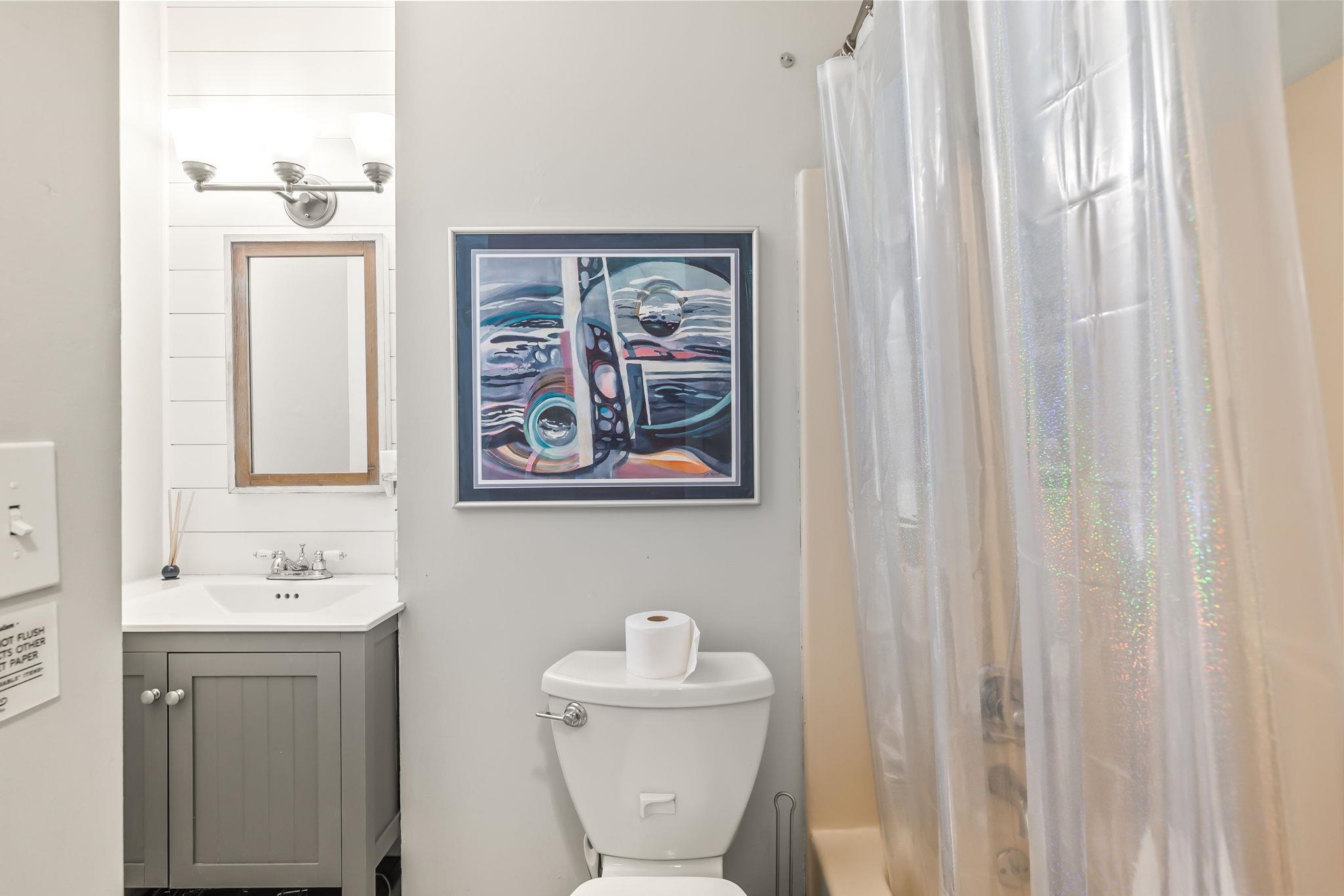 129 Pelican Road St. Augustine, FL 32086 - Photo 21 of 35 a bathroom with a sink mirror and toilet