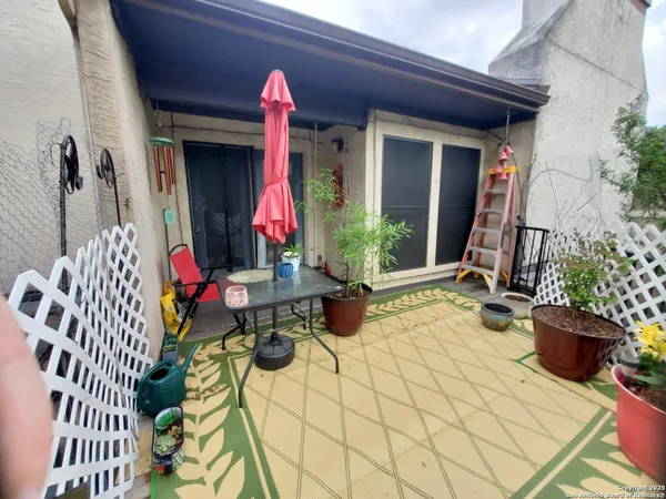 a bedroom with a bed mirror and window
