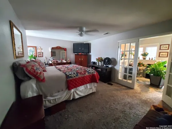 a spacious bathroom with sink and mirror