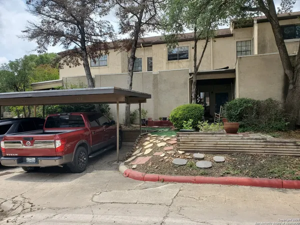 a view of backyard with green space