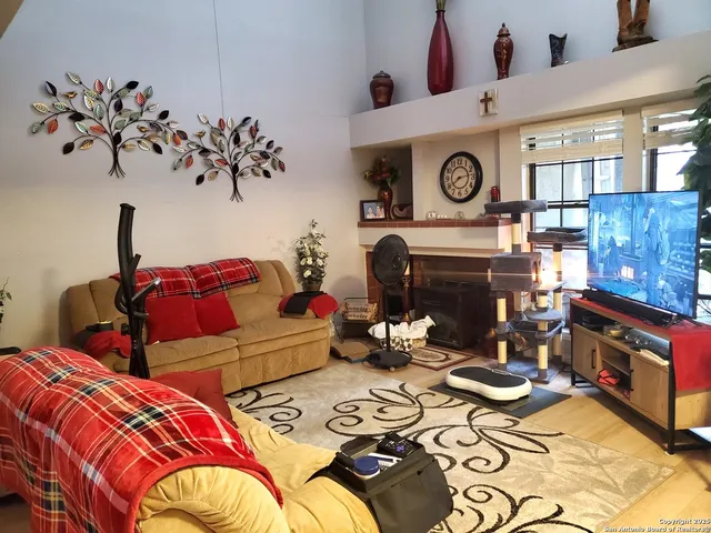 a bedroom with bed and a fireplace