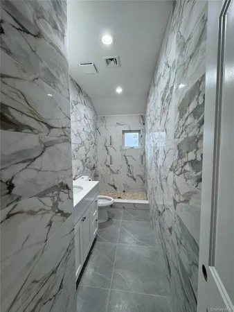 a bathroom with a toilet and a sink