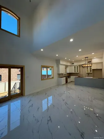 a view of a kitchen with a sink cabinets and a window