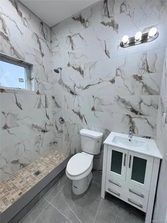 a bathroom with a bathtub and shower