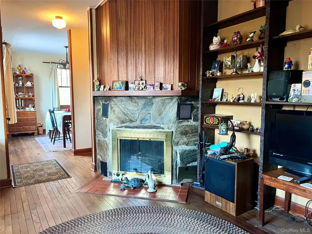 a room with wooden floor and furniture