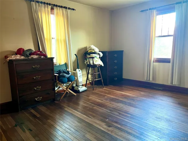 a view of livingroom with hardwood floor and hallway