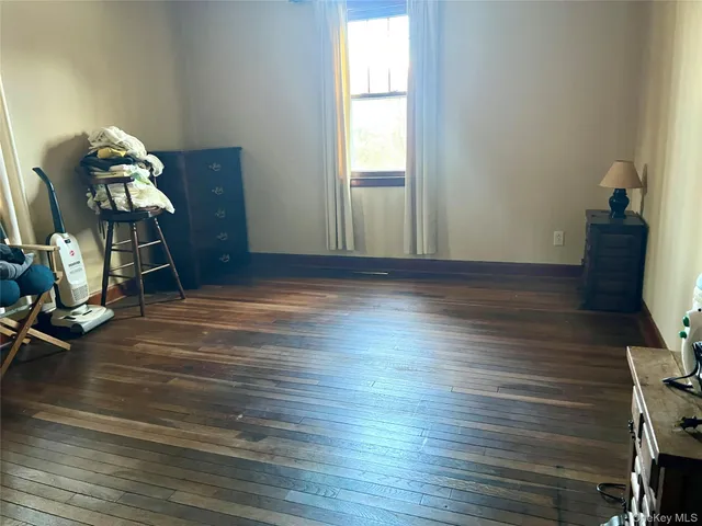 a room with furniture and wooden floor