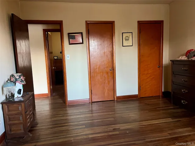 a bedroom with a bed and flat screen tv