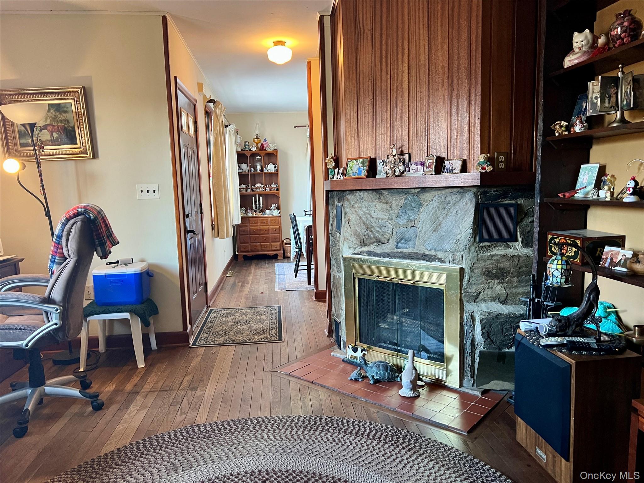 276 Old Hopewell Road Wappingers Falls, NY 12590 - Photo 23 of 28 a living room with furniture a fireplace and bookshelf