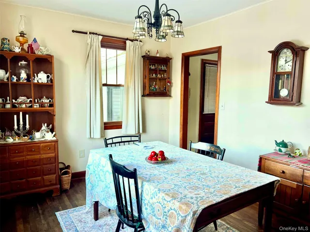 a dining room with a table and chairs