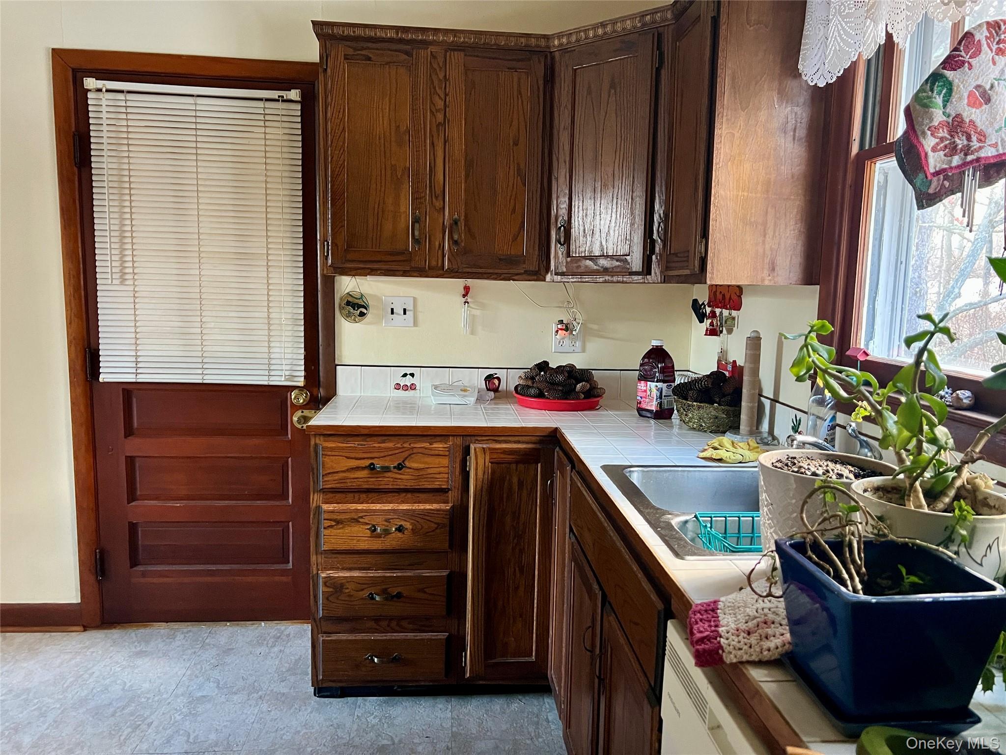 276 Old Hopewell Road Wappingers Falls, NY 12590 - Photo 9 of 28 a kitchen with a cabinets and potted plant