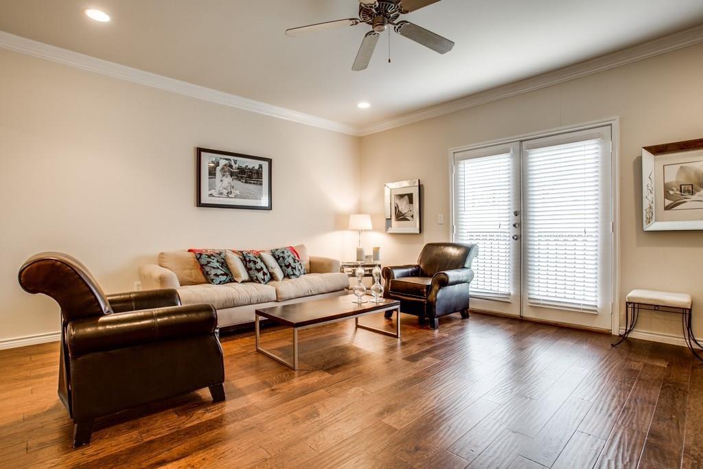 3102 Kings Road, Unit 3310 Dallas, TX 75219 - Photo 5 of 19 a living room with furniture and a wooden floor