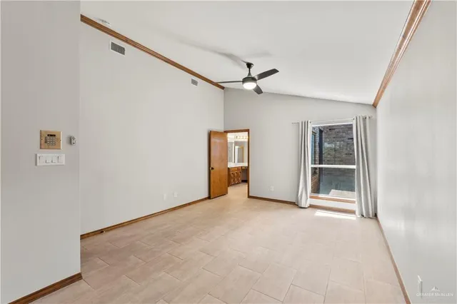 a view of an empty room with a window