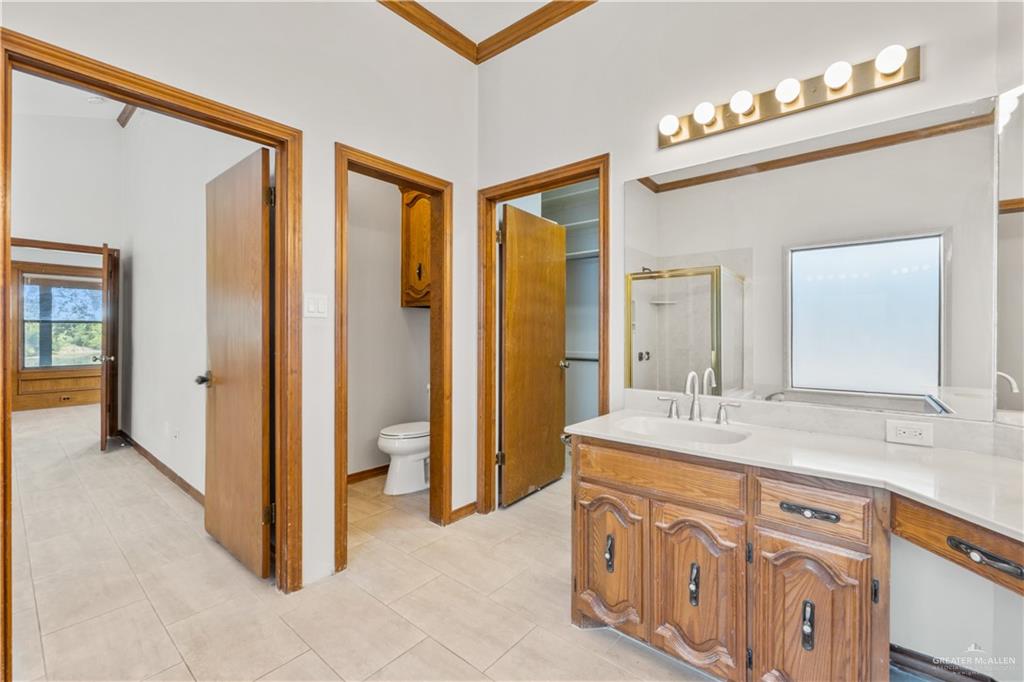 814 Rio Grande Drive Mission, TX 78572 - Photo 13 of 29 a spacious bathroom with a double vanity sink a mirror and a shower