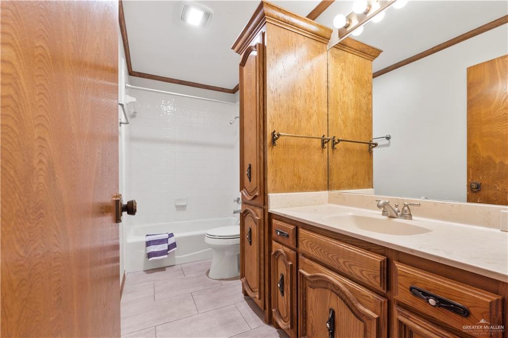 814 Rio Grande Drive Mission, TX 78572 - Photo 18 of 29 a bathroom with a sink toilet and shower