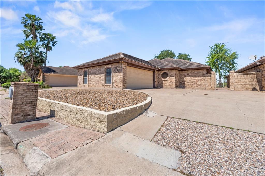 814 Rio Grande Drive Mission, TX 78572 - Photo 2 of 29 a front view of a house with a yard