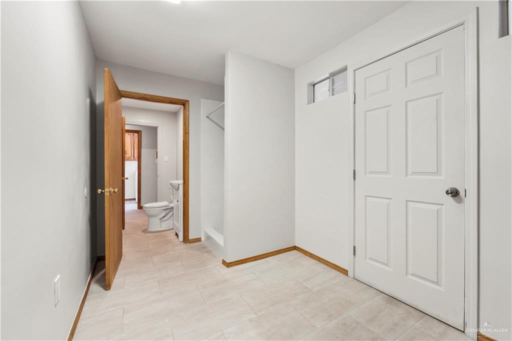 814 Rio Grande Drive Mission, TX 78572 - Photo 21 of 29 a view of a room with an empty space and wooden floor