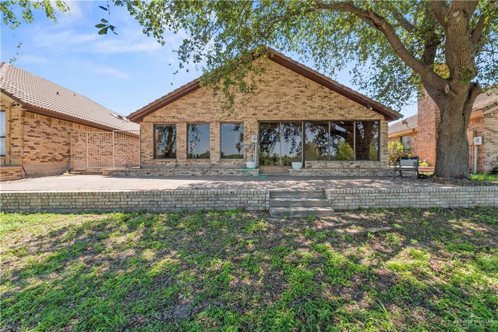 814 Rio Grande Drive Mission, TX 78572 - Photo 27 of 29 a front view of a house with garden