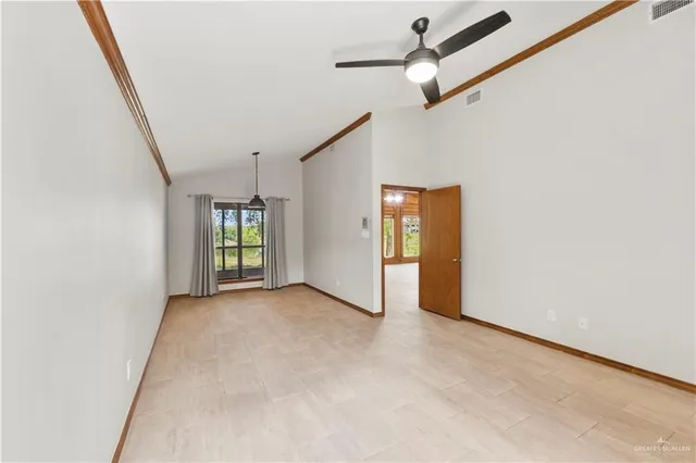 a view of an empty room with a window