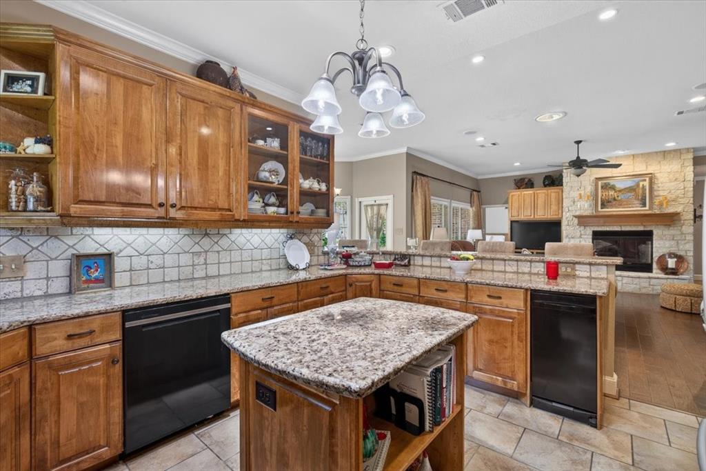 111 Trailwood Road Enchanted Oaks, TX 75156 - Photo 11 of 33 a kitchen with stainless steel appliances granite countertop a sink and cabinets