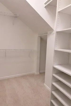 a view of an empty walk in closet