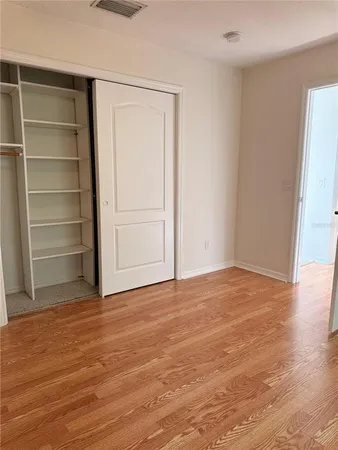 a view of an empty room with a empty space and a window