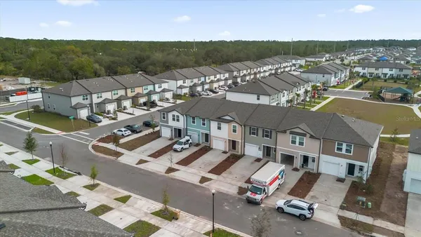 an aerial view of a house with a garden