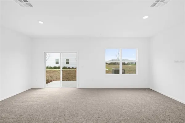an empty room with a empty space and window