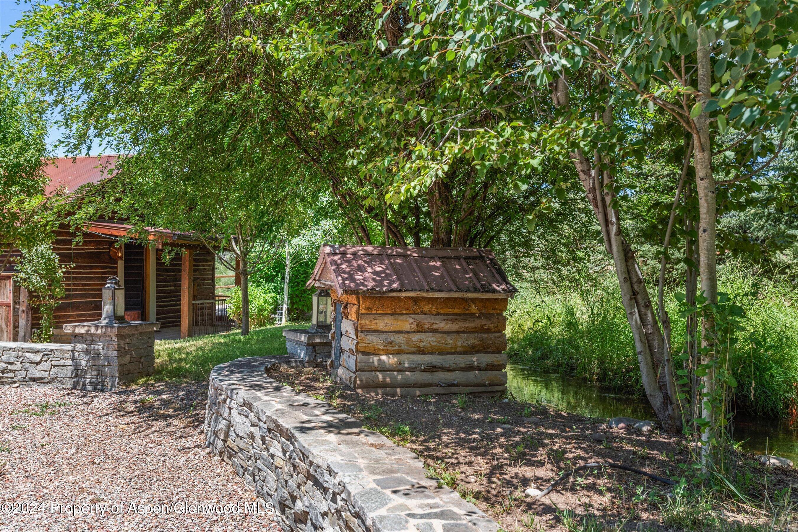 969 Willits Lane Basalt, CO 81621 - Photo 40 of 96 a front view of a house with a garden