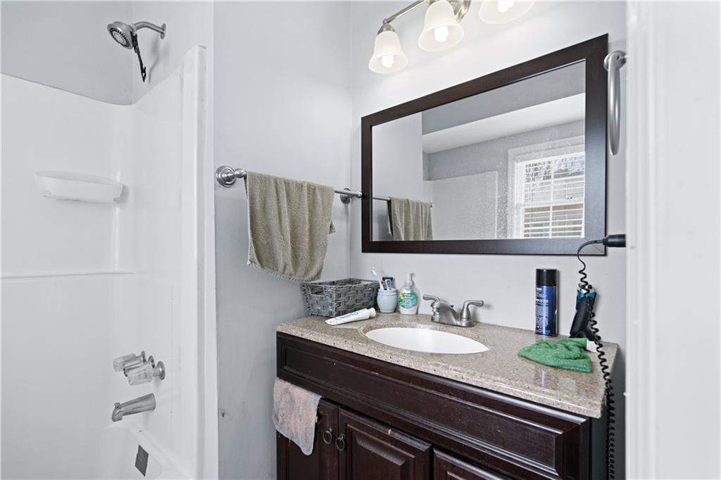 237 Chads Ford Way Roswell, GA 30076 - Photo 16 of 22 a bathroom with a sink and a mirror