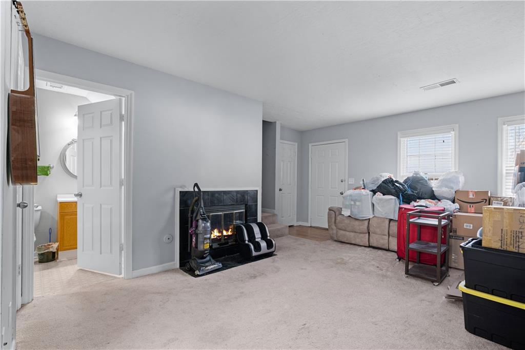 237 Chads Ford Way Roswell, GA 30076 - Photo 5 of 22 a living room with furniture a window and a flat tv screen