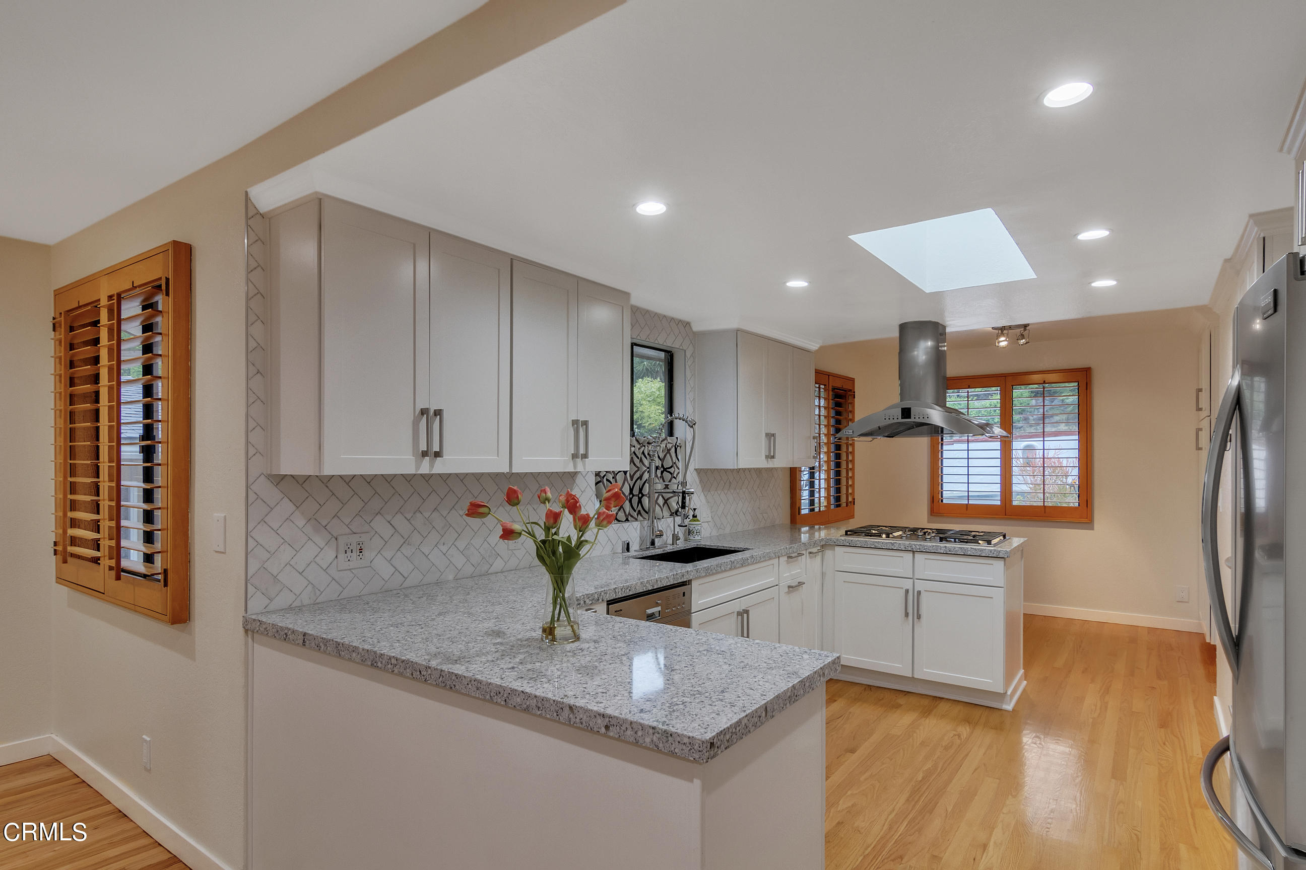 524 Franklin Place Monrovia, CA 91016 - Photo 12 of 33 a kitchen with stainless steel appliances granite countertop a sink refrigerator and cabinets