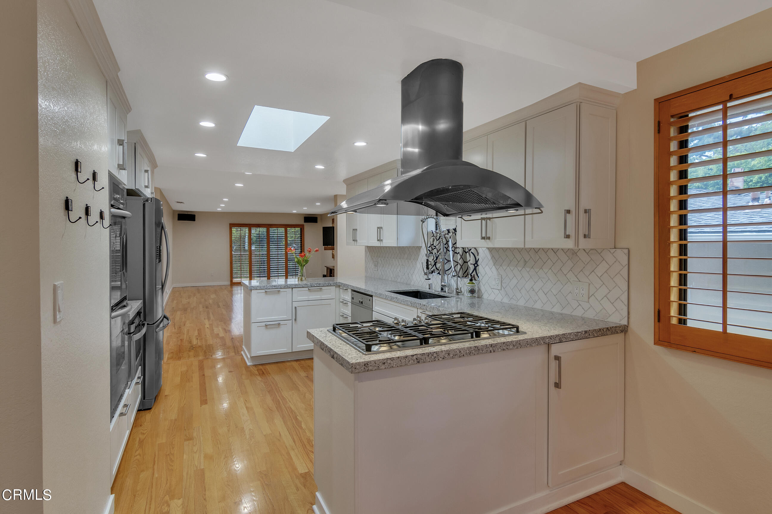 524 Franklin Place Monrovia, CA 91016 - Photo 7 of 33 a kitchen with stainless steel appliances granite countertop a stove and a refrigerator