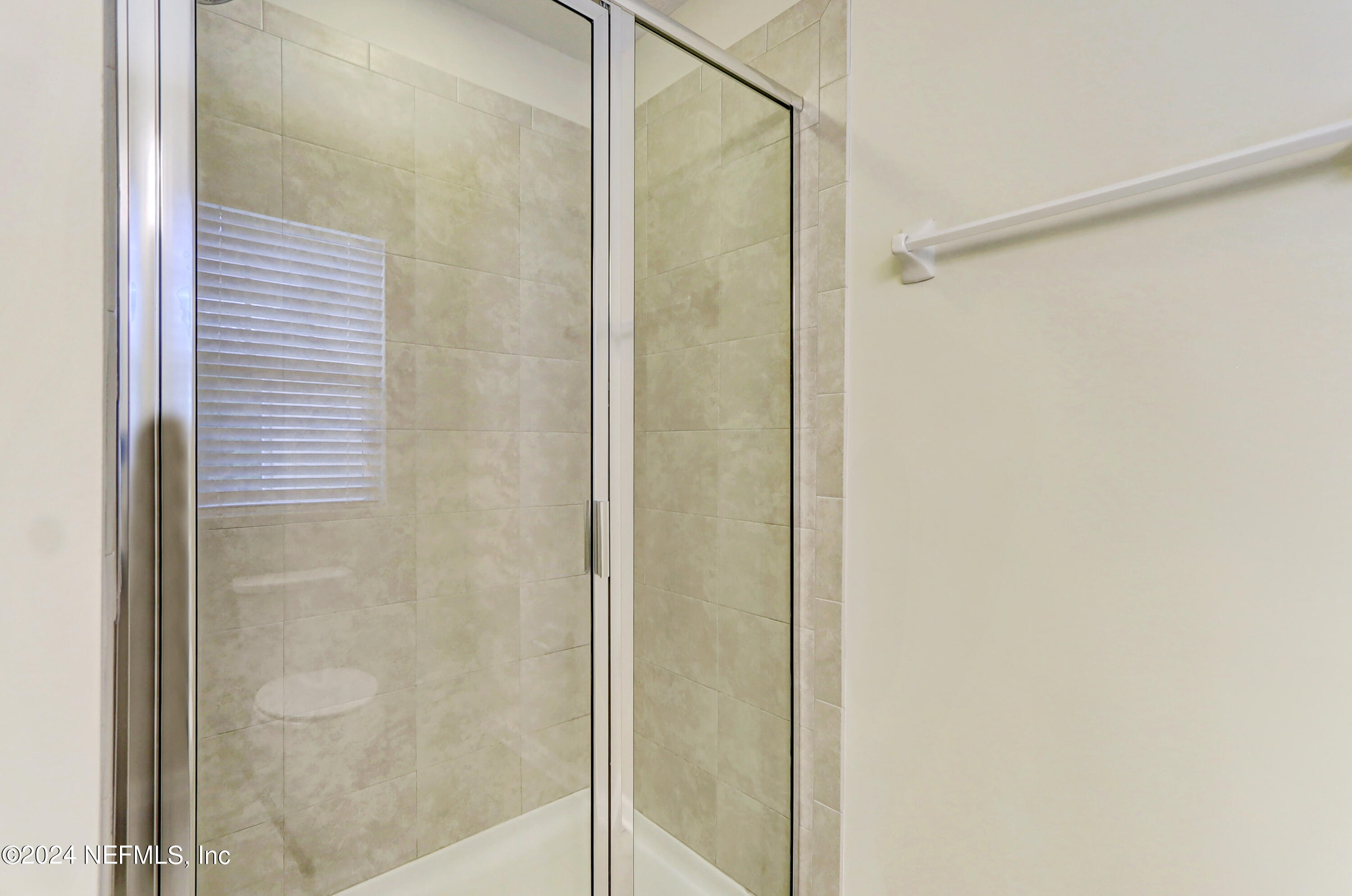 95 Nelson Lane St. Johns, FL 32259 - Photo 22 of 30 a bathroom with a glass shower door