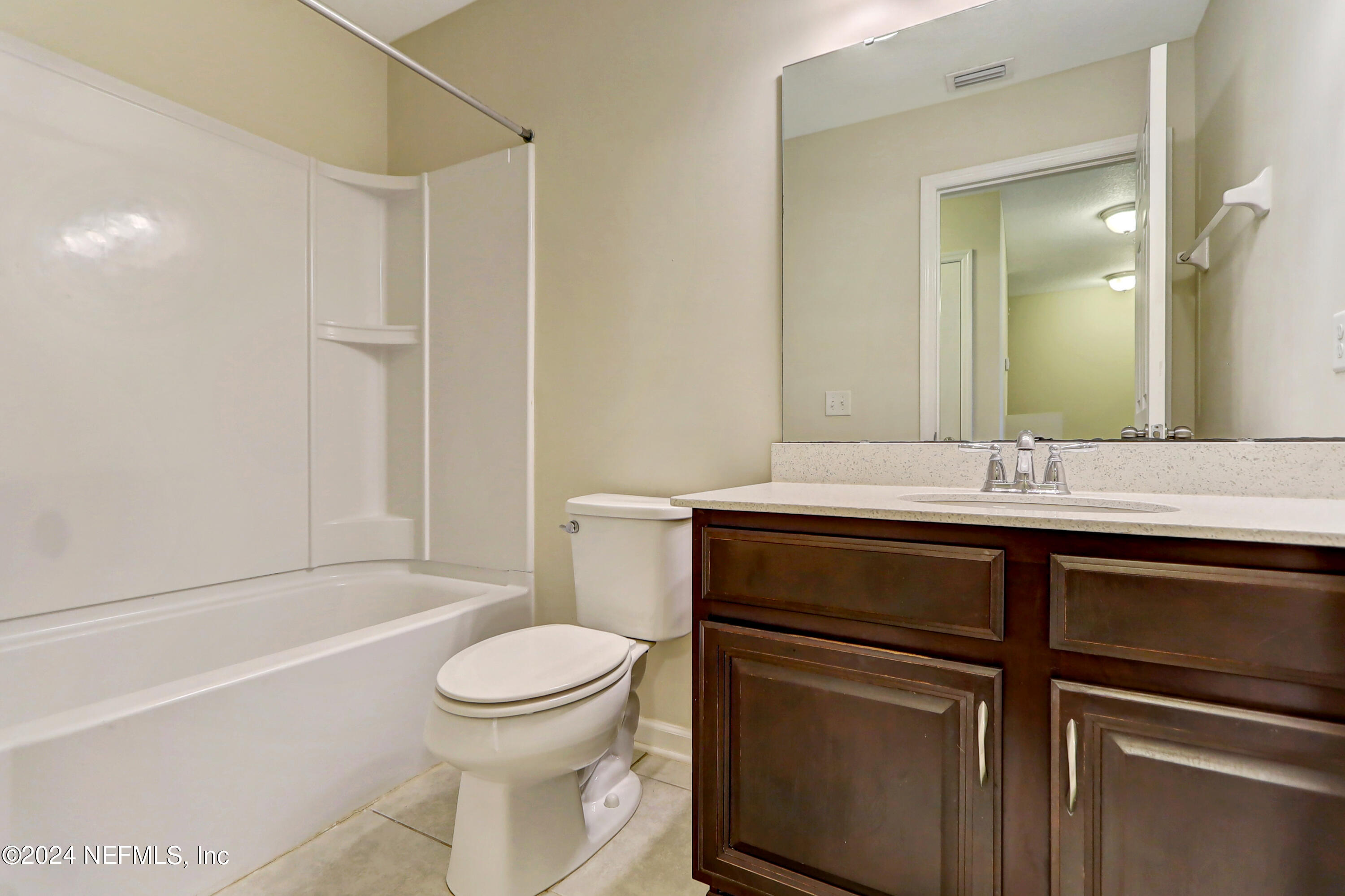 95 Nelson Lane St. Johns, FL 32259 - Photo 25 of 30 a bathroom with a sink toilet vanity and shower